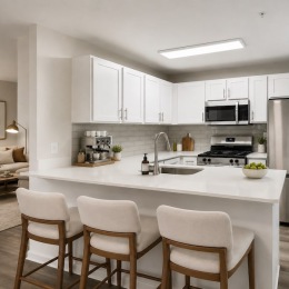 a kitchen with white cabinets